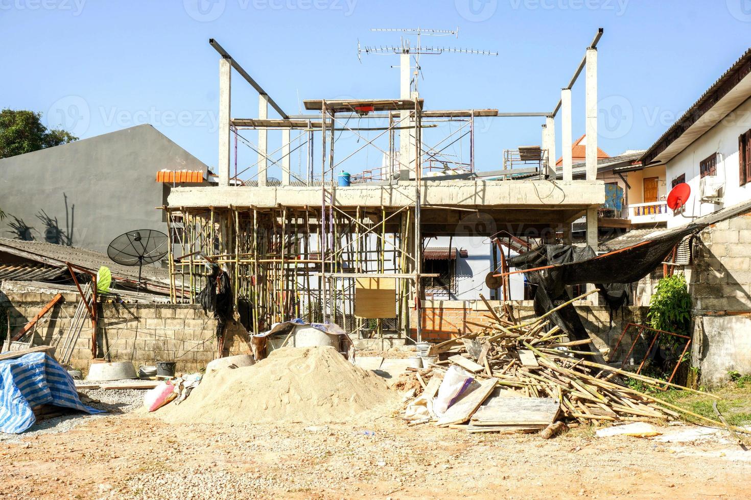 Wood, stone, sand with construction equipment at home construction site. photo