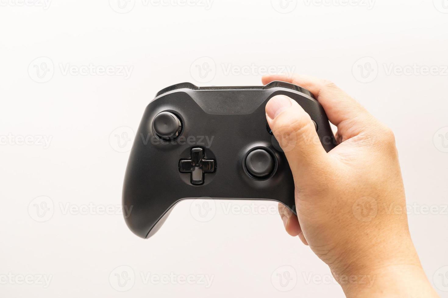 Black joystick in hands isolated on white background. Computer gaming technology play competition video game control confrontation concept. esport concept. photo