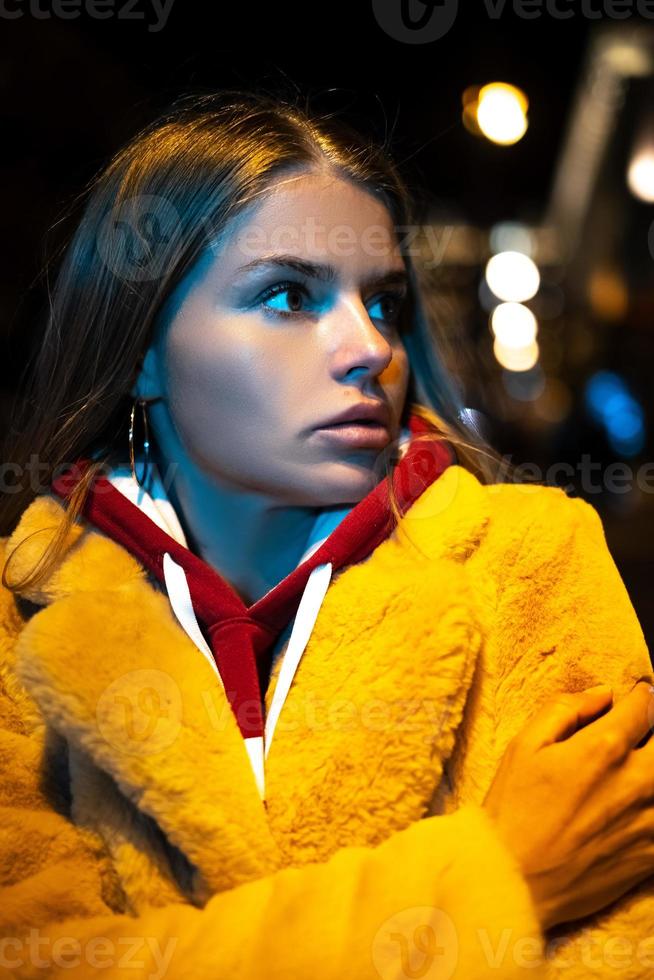 portrait of a girl against the background of a night city photo