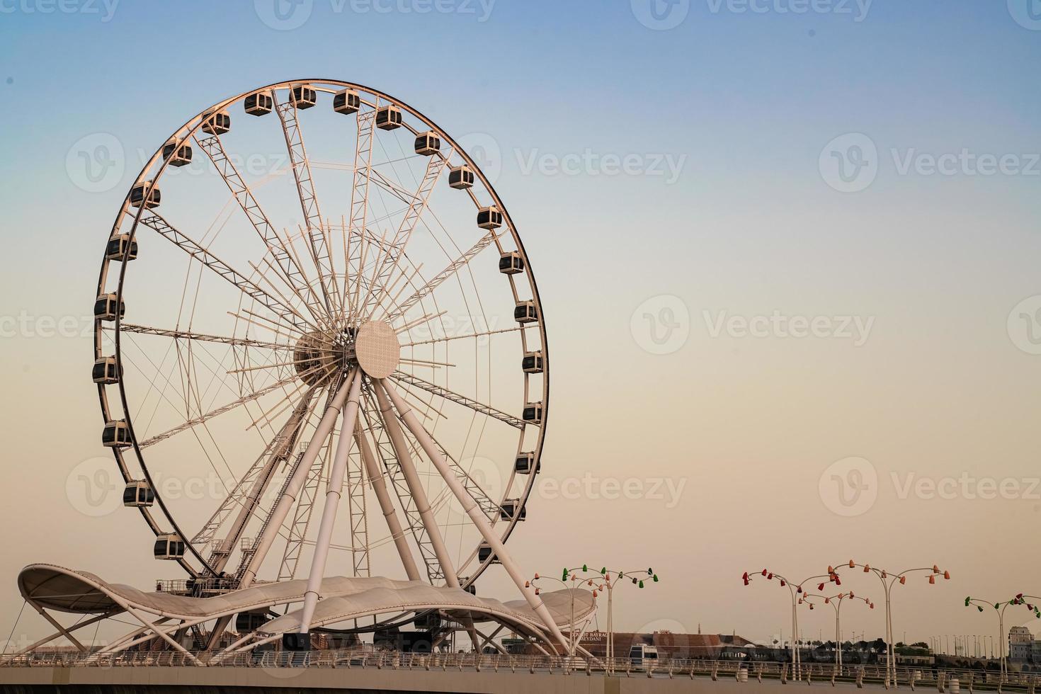 ferris wheel on the sunset sky photo