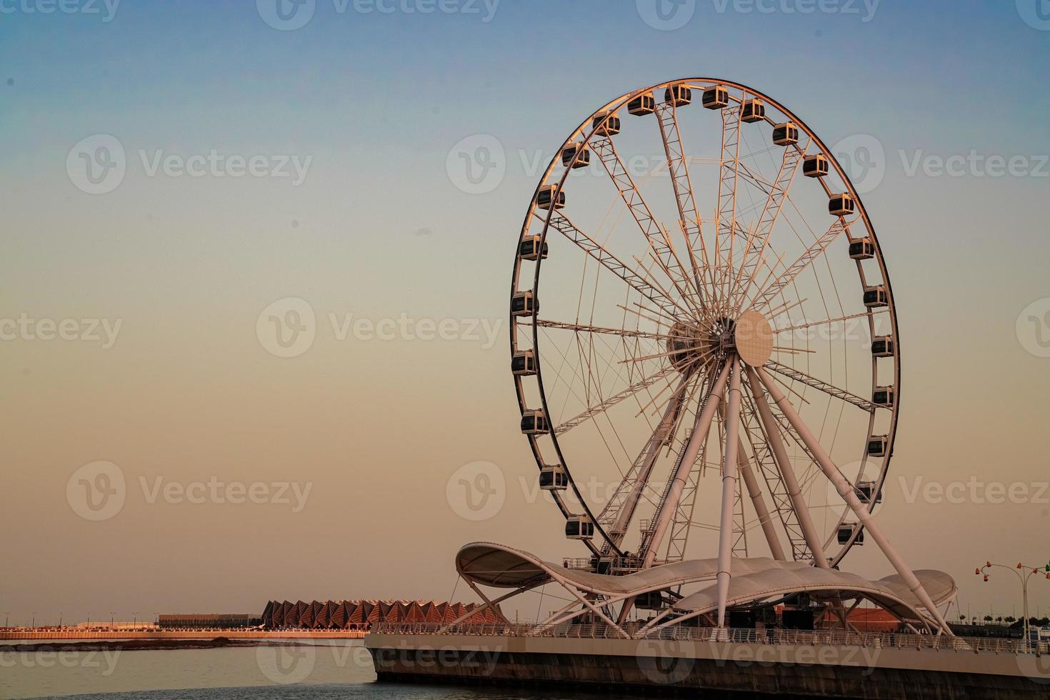 ferris wheel on the sunset sky photo