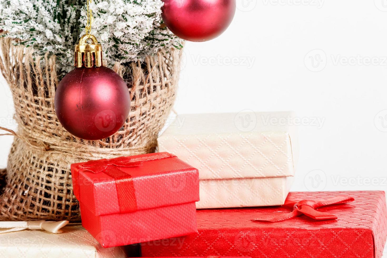 Christmas tree gift boxes with toys on a white background photo