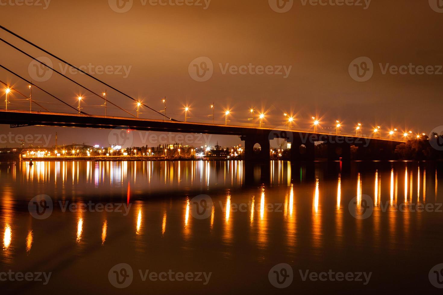 night city with reflection of houses in the river photo