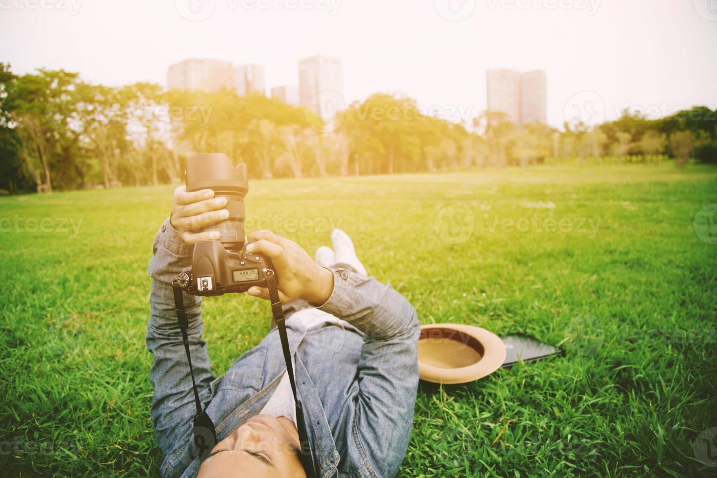 A man using a camera photo