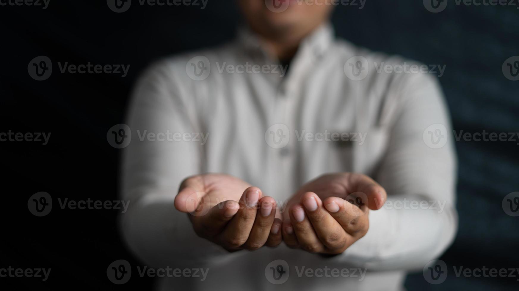 Two hands business man raises something for graphic layout, copy space, and digital background photo