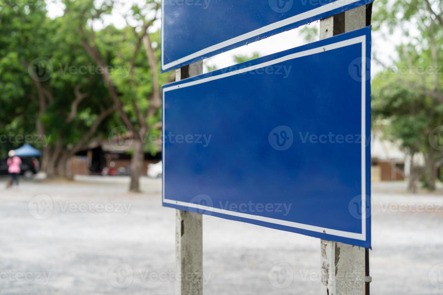 Blue traffic sign in paking lots with tree around. Clipping Paths photo