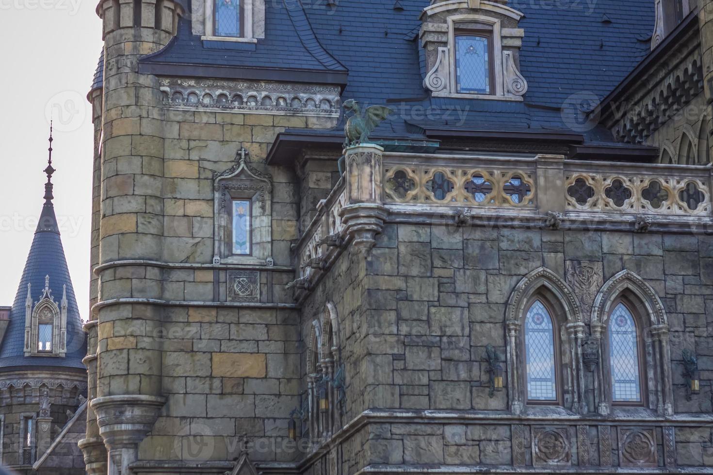 Antiquity in detail. Decoration of houses, balconies, windows, sculptures, walls. Elements of architectural design of buildings. Old plaster, Stone decorations. Elements of Gothic architecture photo