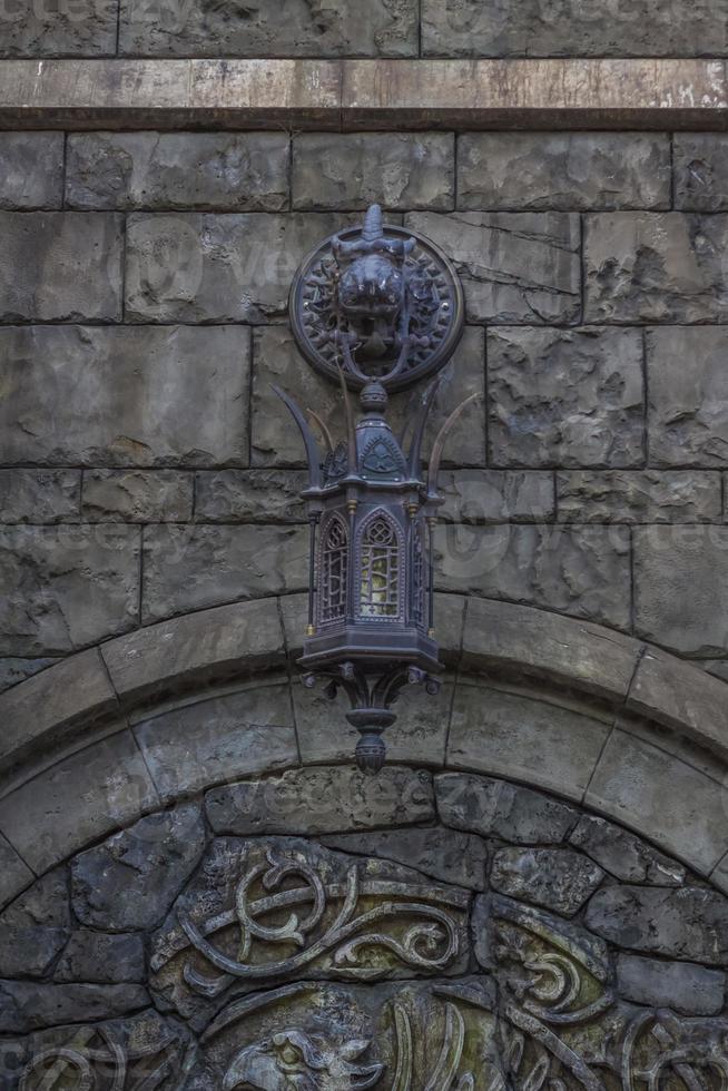 Antiquity in detail. Decoration of houses, balconies, windows, sculptures, walls. Elements of architectural design of buildings. Old plaster, Stone decorations. Elements of Gothic architecture photo