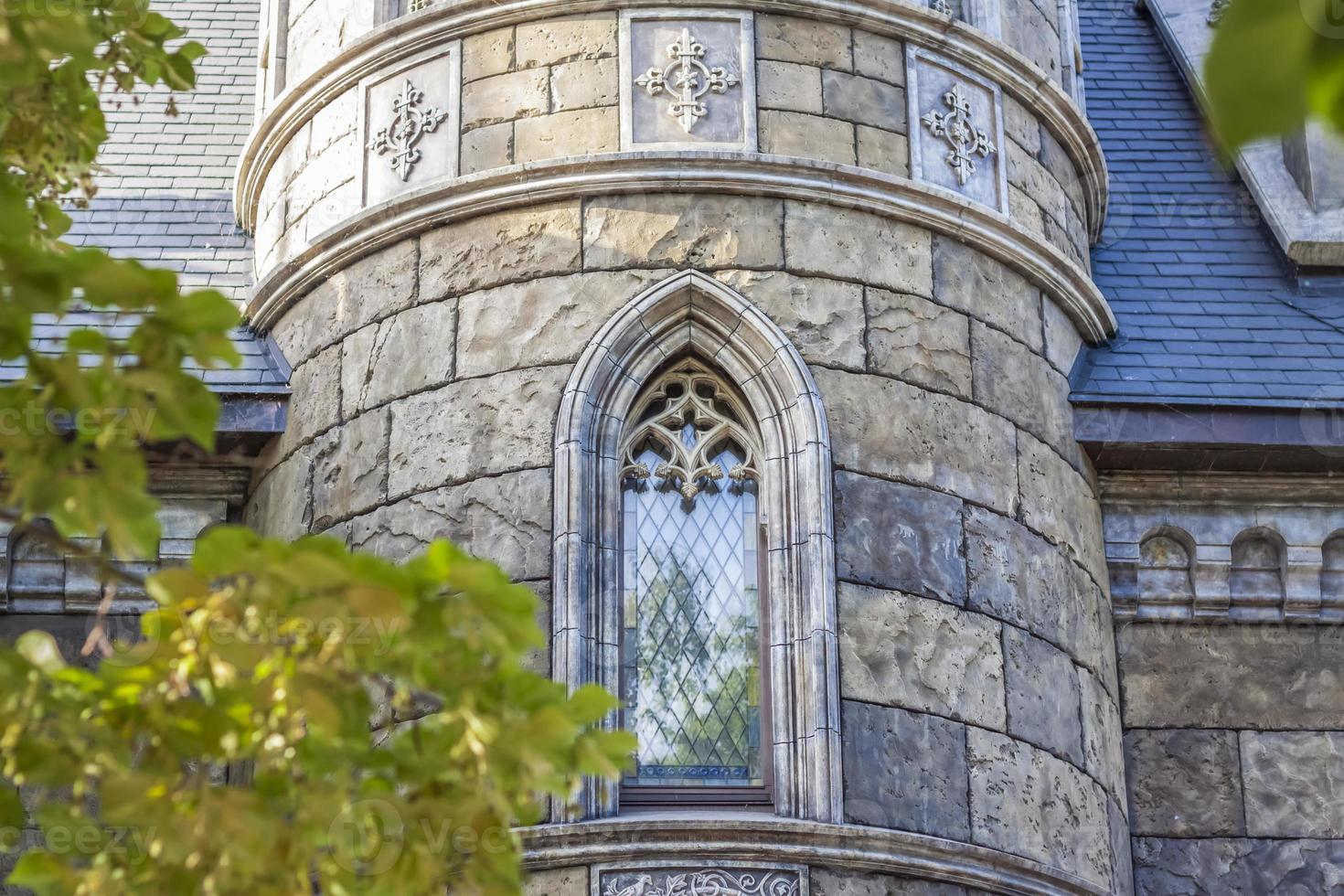 Antiquity in detail. Decoration of houses, balconies, windows, sculptures, walls. Elements of architectural design of buildings. Old plaster, Stone decorations. Elements of Gothic architecture photo