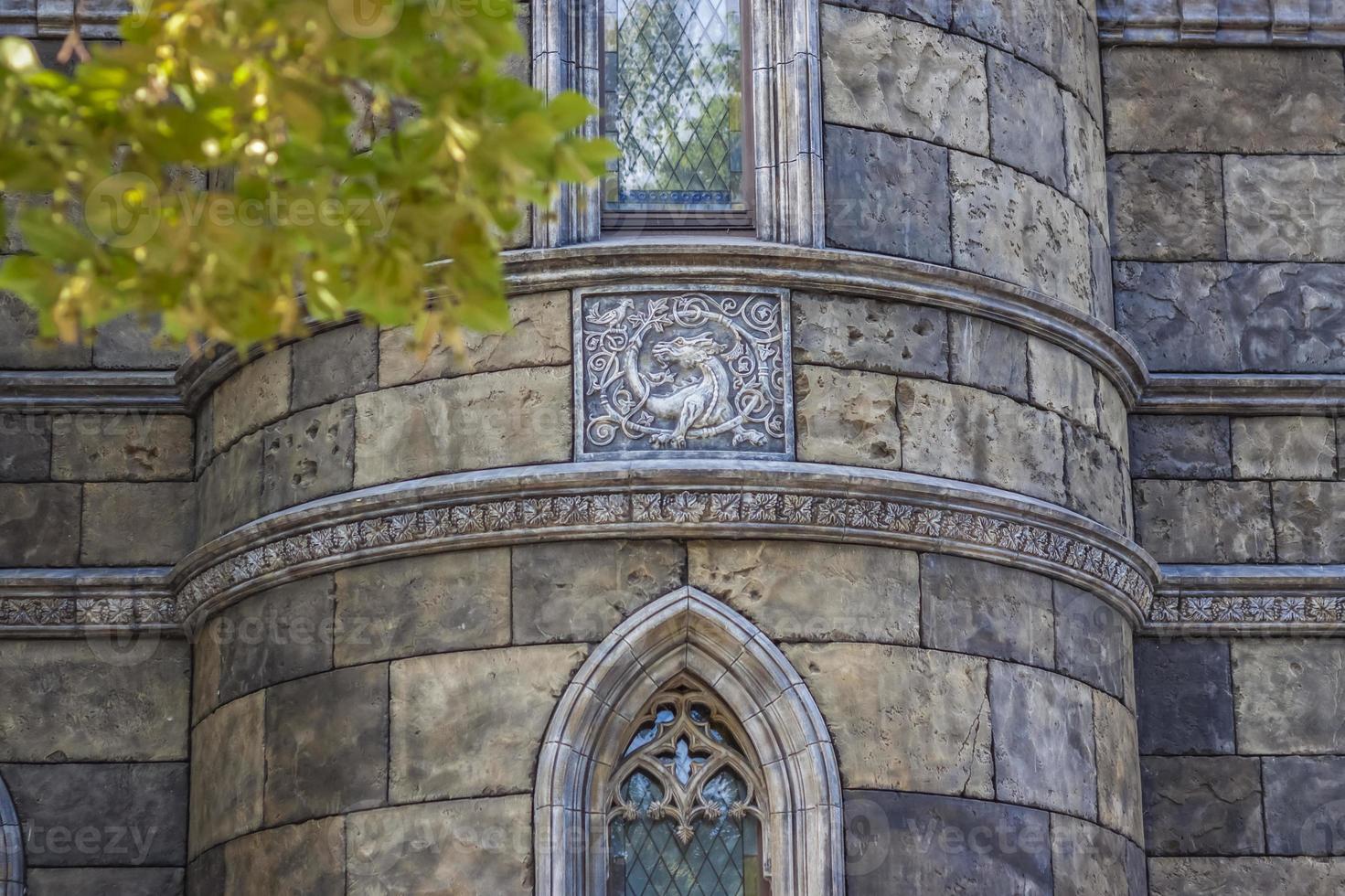 Antiquity in detail. Decoration of houses, balconies, windows, sculptures, walls. Elements of architectural design of buildings. Old plaster, Stone decorations. Elements of Gothic architecture photo