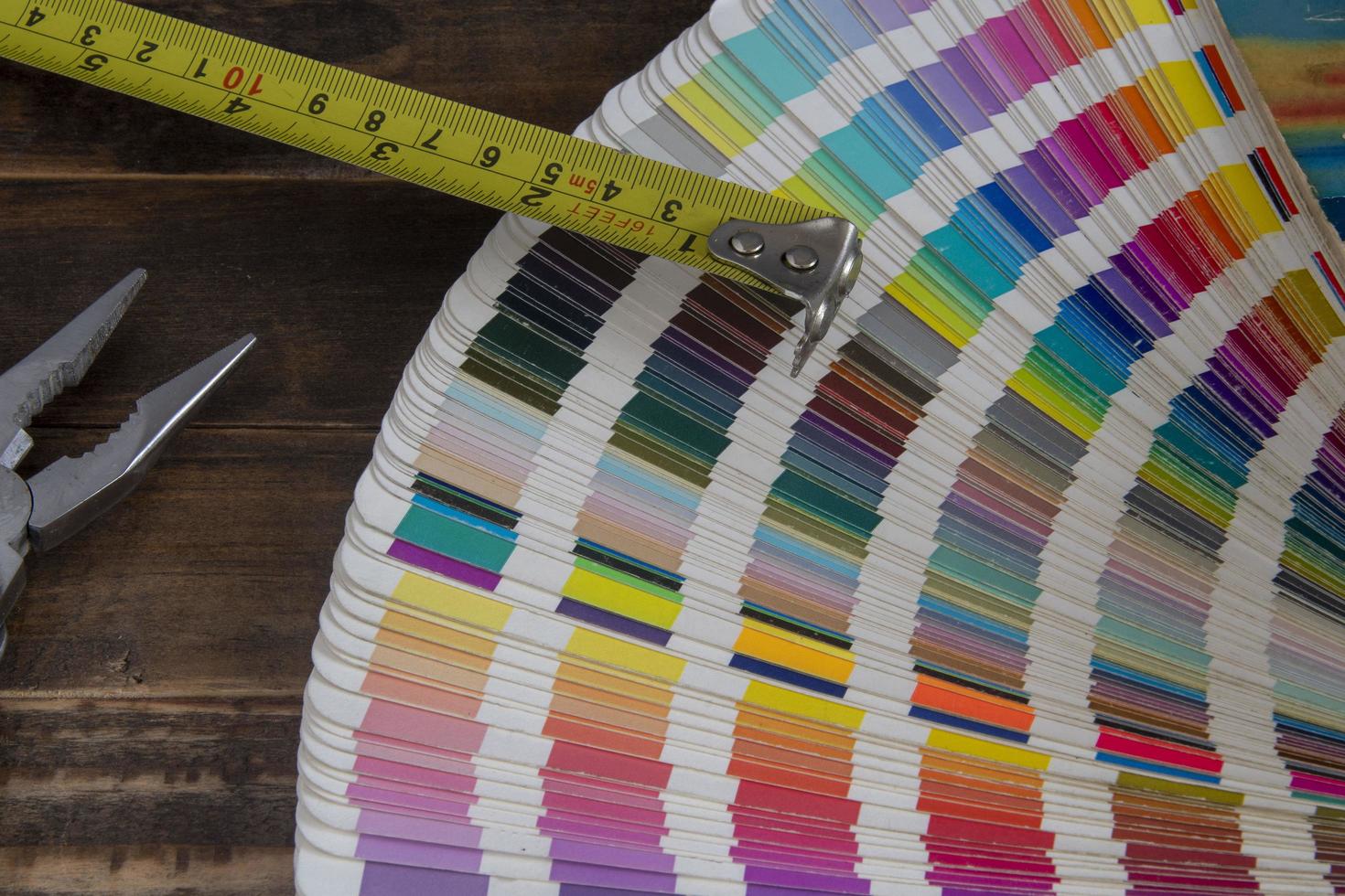 Color swatches used in graphic arts, with a measuring tape used in construction photo