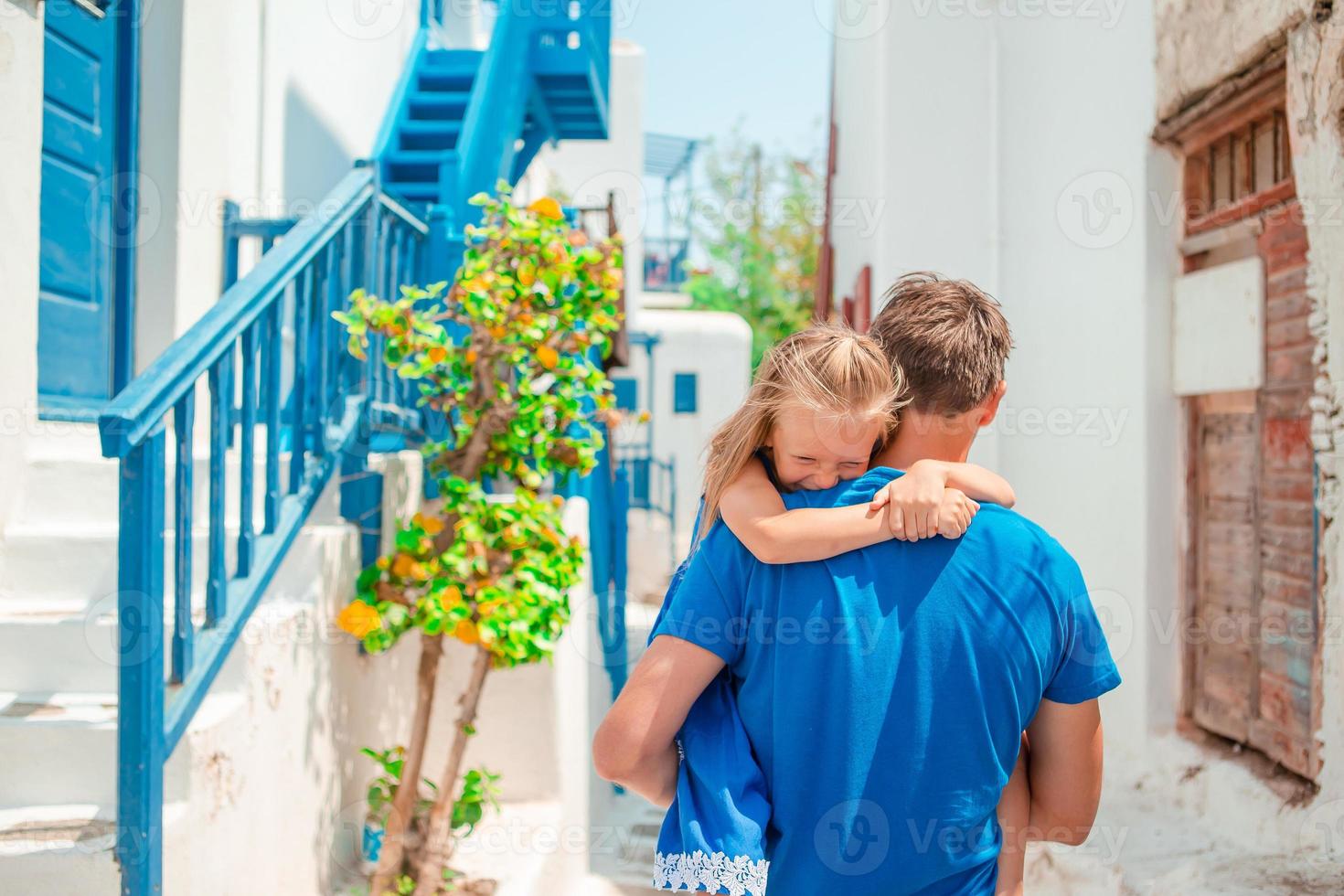 Happy dad and little adorable girl traveling in Mykonos, Greece photo