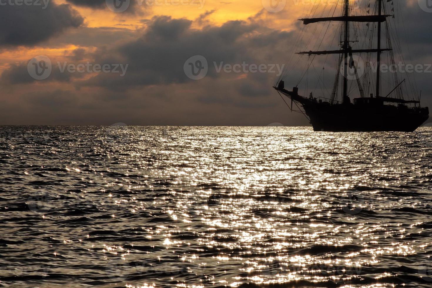 old vessel silhouette at sunset photo