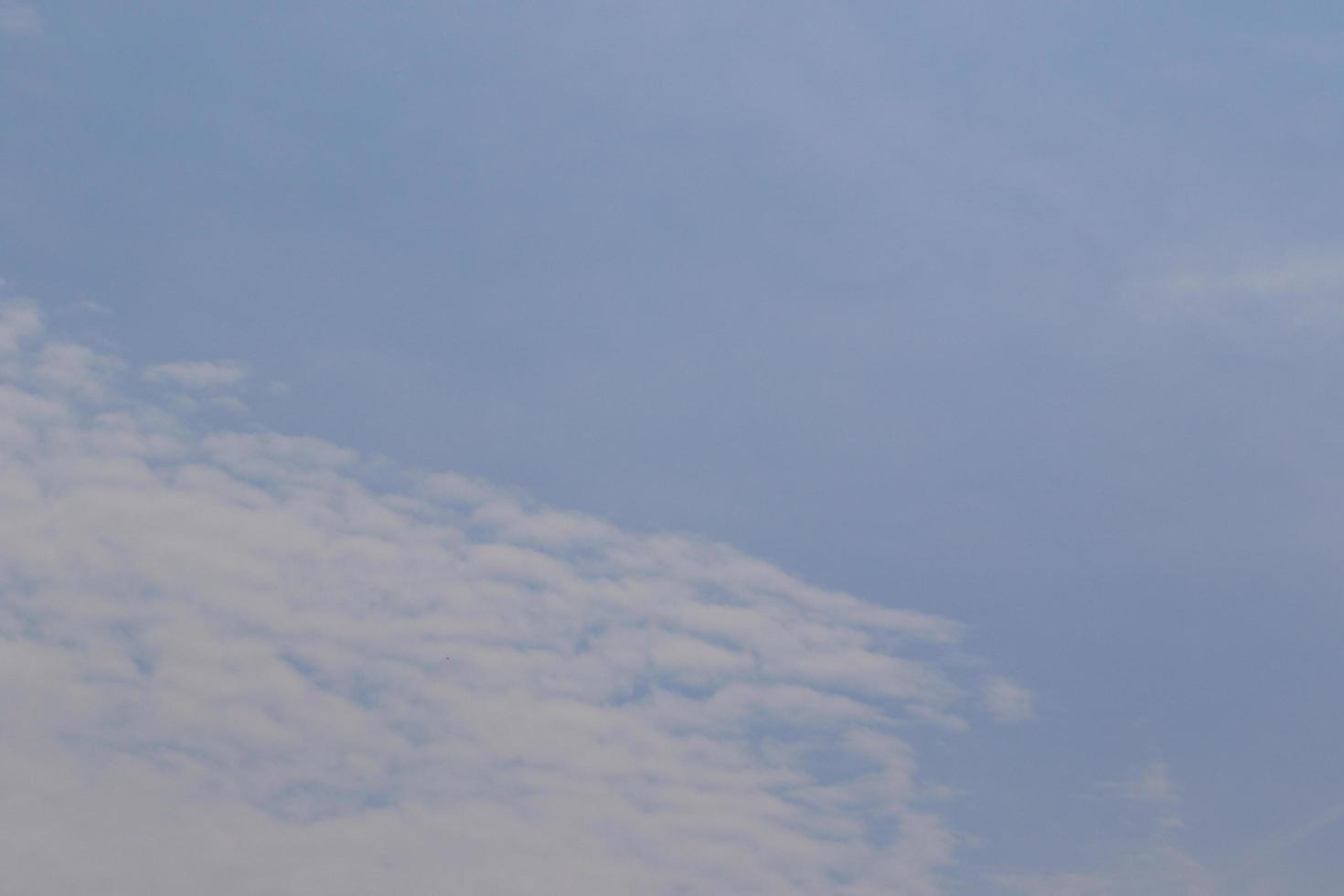 Clear blue sky and white clouds photo