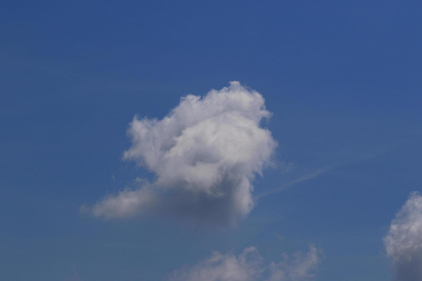 Clear blue sky and white clouds photo