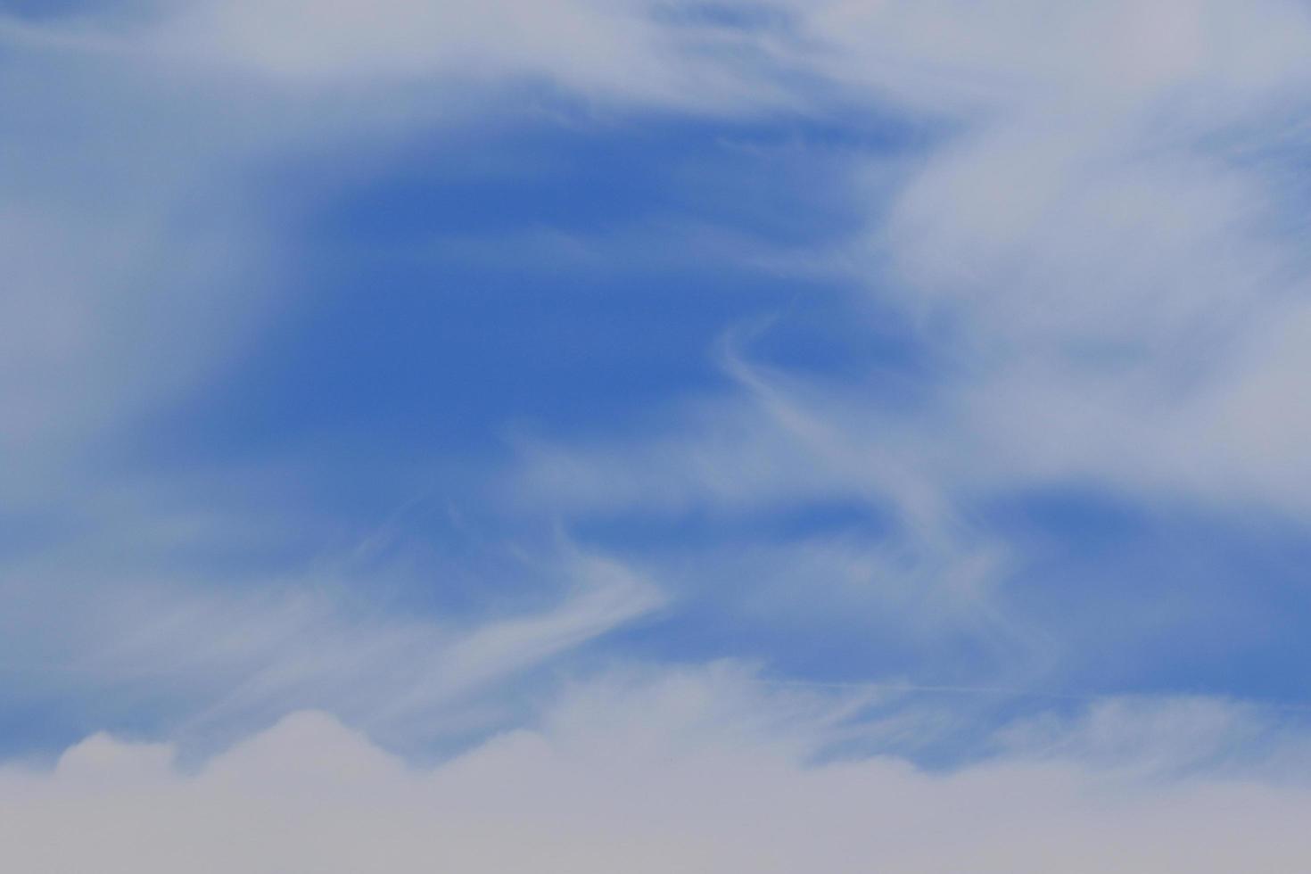 Clear blue sky and white clouds photo