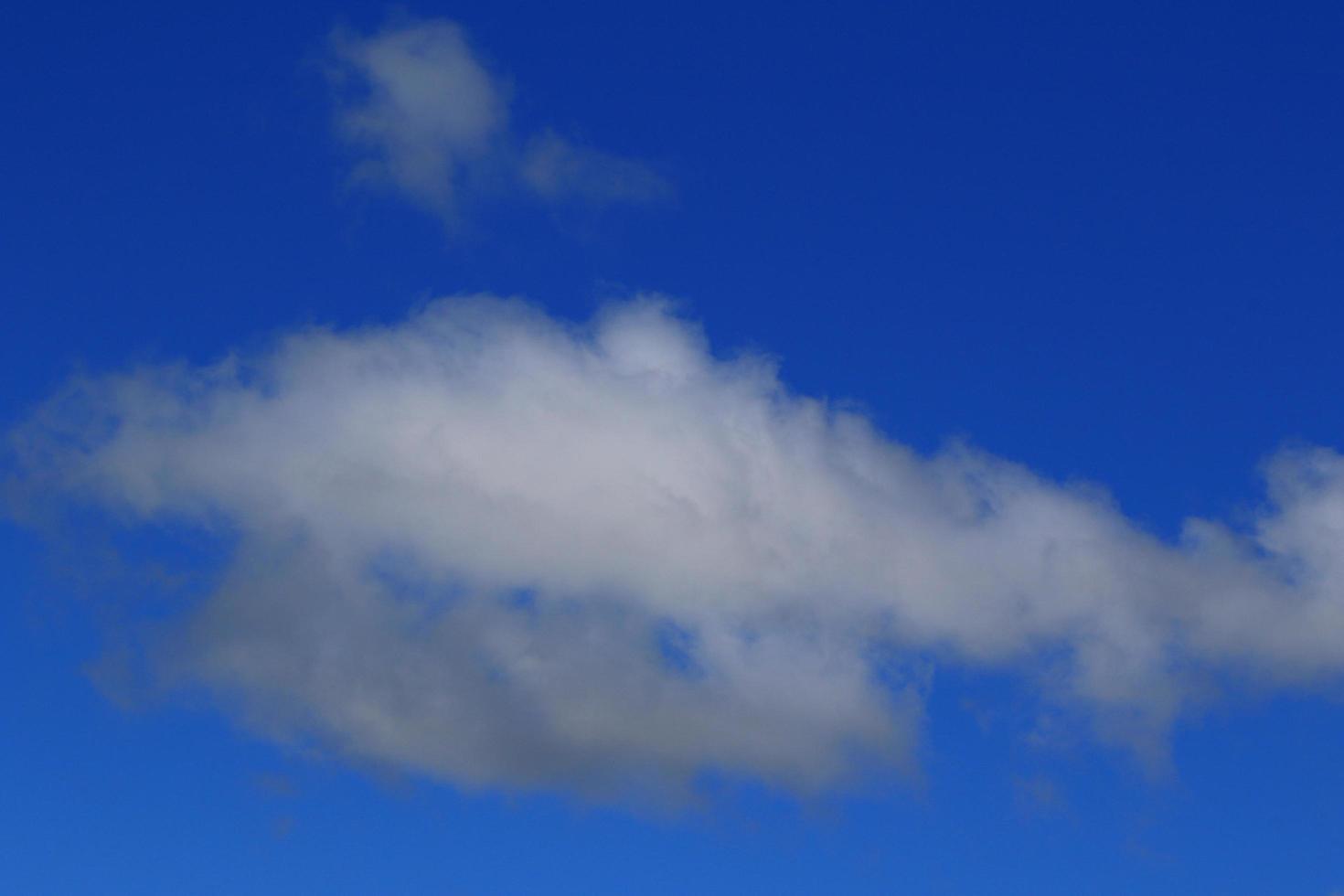 Clear blue sky and white clouds photo