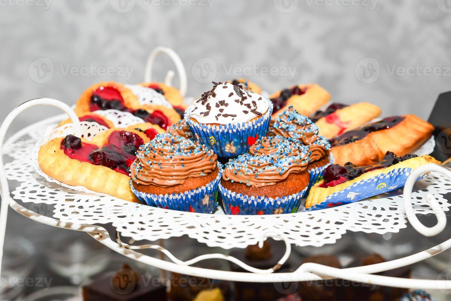 delicious sweets arranged on the table for event reception photo