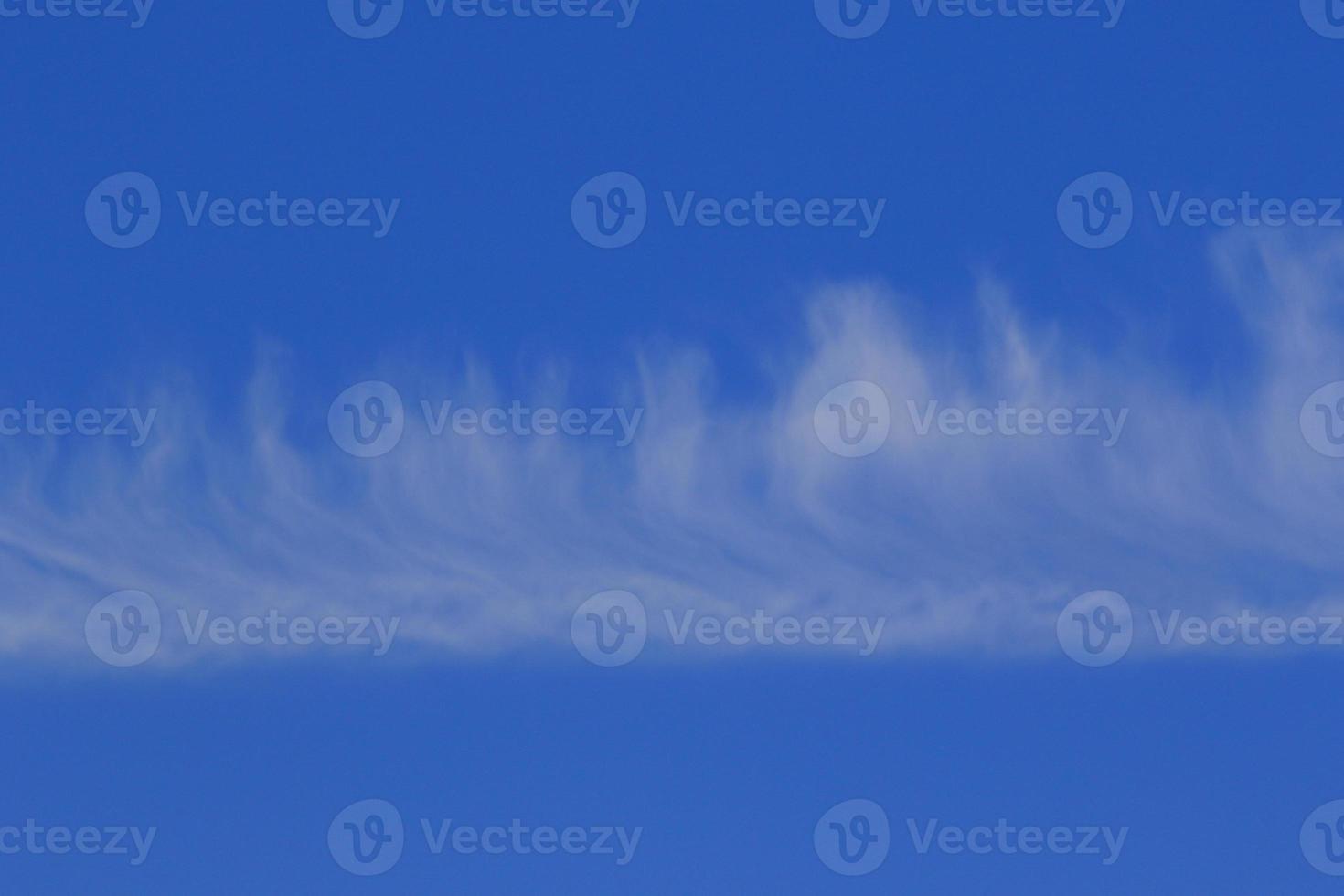 Clear blue sky and white clouds photo