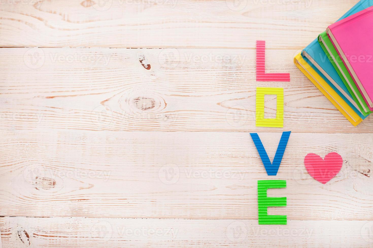 Word love on blue wooden background. Top view photo