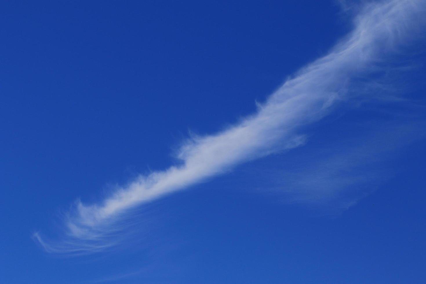 Clear blue sky and white clouds photo