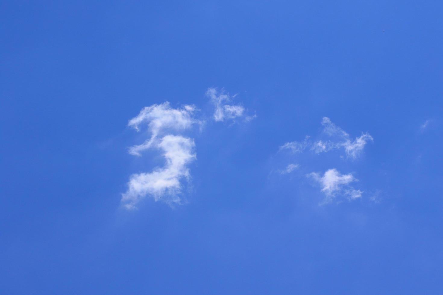 Clear blue sky and white clouds photo