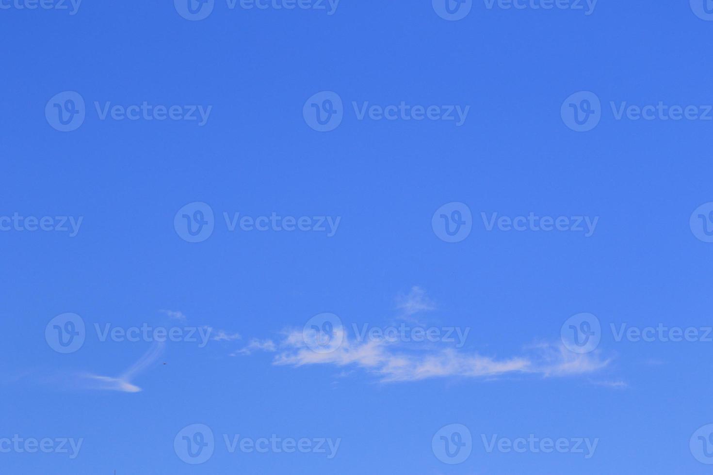 Clear blue sky and white clouds photo