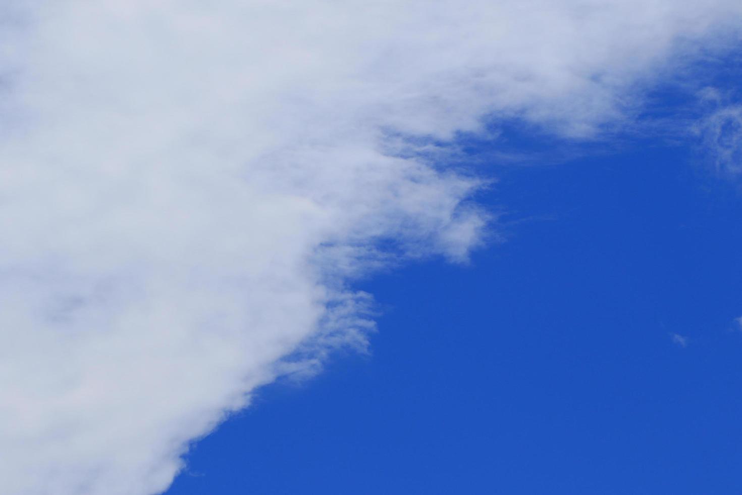 Clear blue sky and white clouds photo