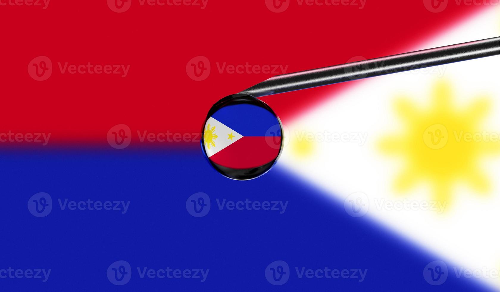 Vaccine syringe with drop on needle against national flag of Philippines background. Medical concept vaccination. Coronavirus Sars-Cov-2 pandemic protection. National safety idea. photo