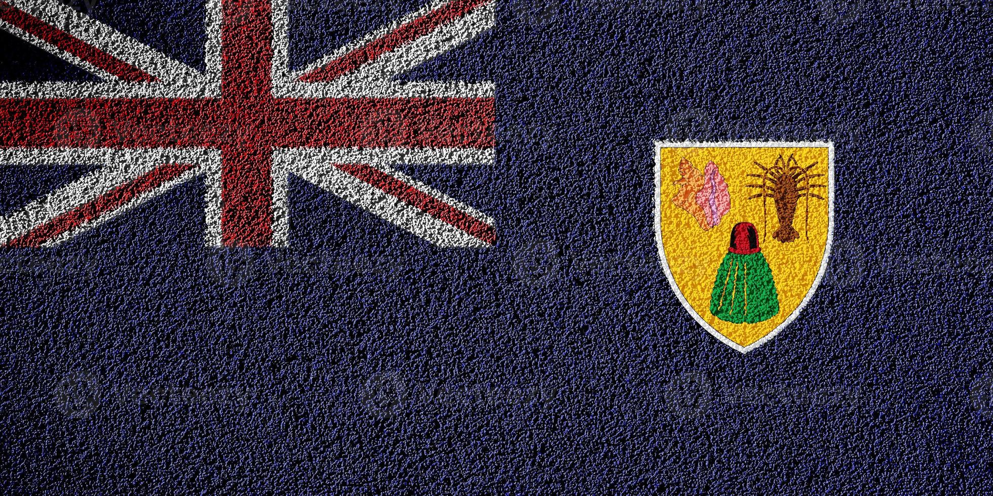 Flag of the British Overseas Territory of the Turks and Caicos Islands on a textured background. Concept collage. photo