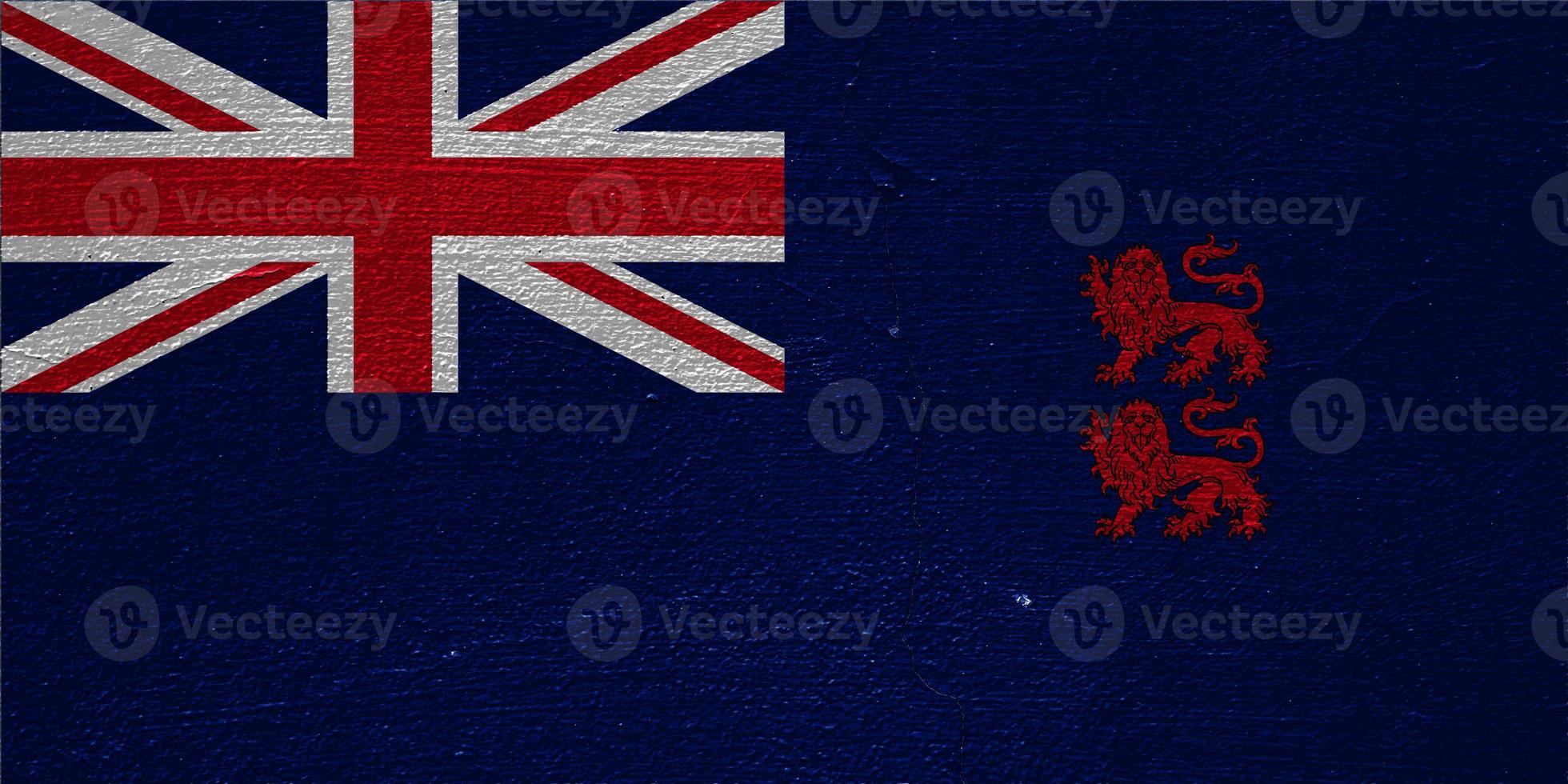 Flag of the British Overseas Territory of the officially the Sovereign Base Areas of Akrotiri and Dhekelia on a textured background. Concept collage. photo