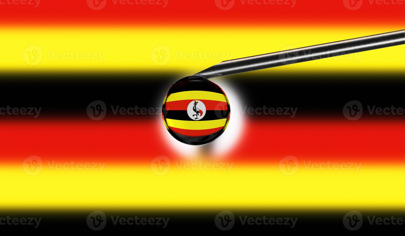 Vaccine syringe with drop on needle against national flag of Uganda background. Medical concept vaccination. Coronavirus Sars-Cov-2 pandemic protection. National safety idea. photo