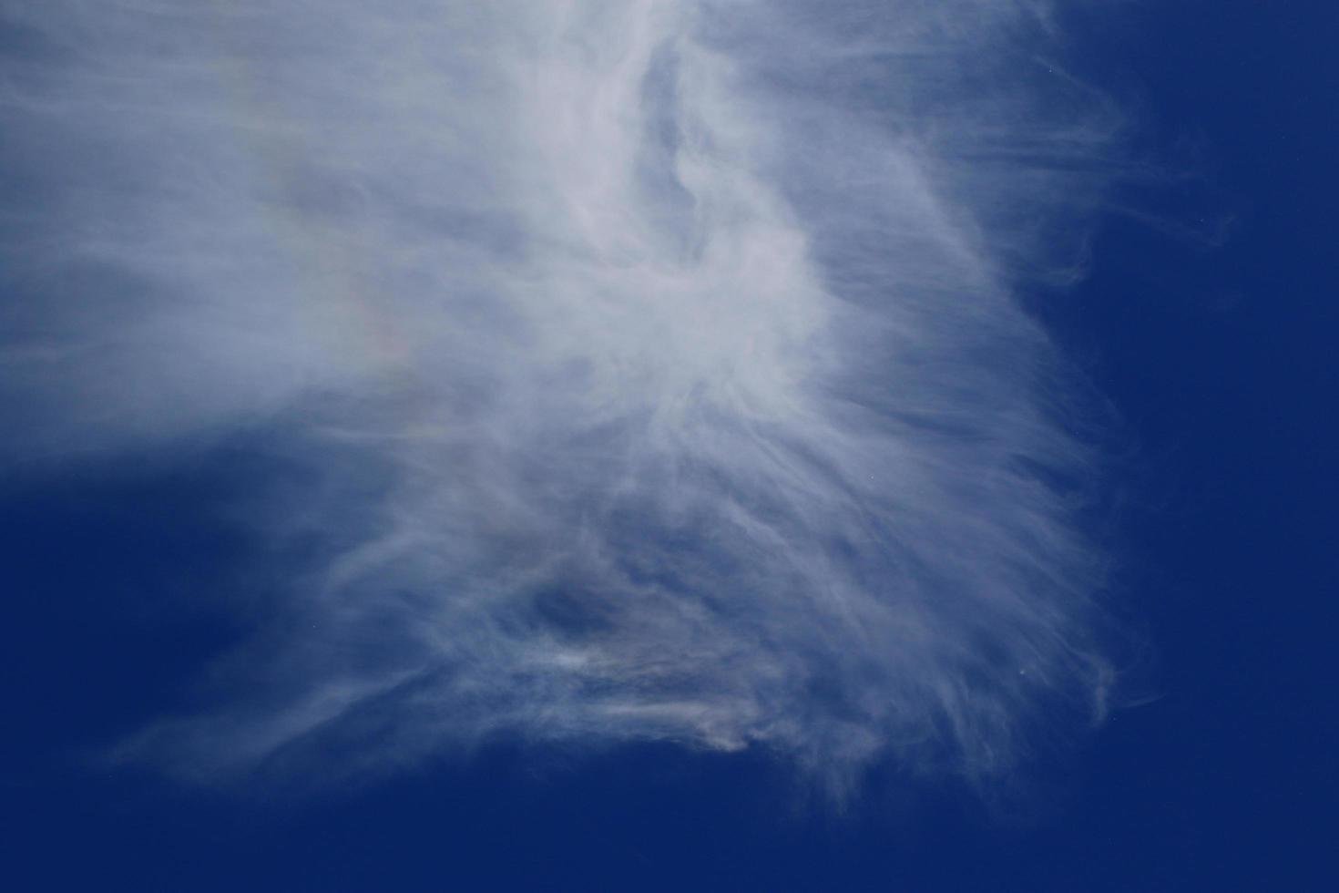 Clear blue sky and white clouds photo