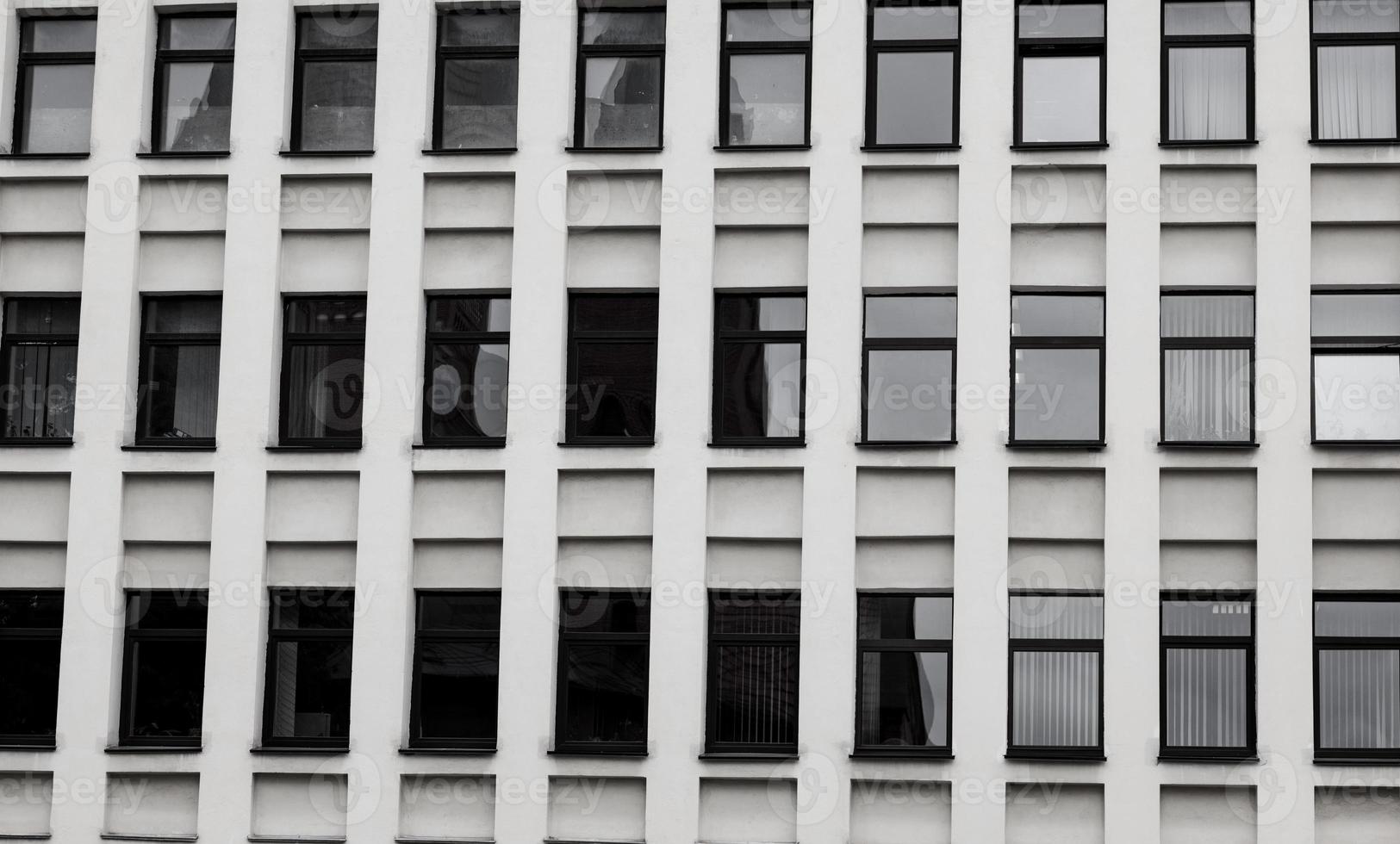 concrete building with many windows. photo