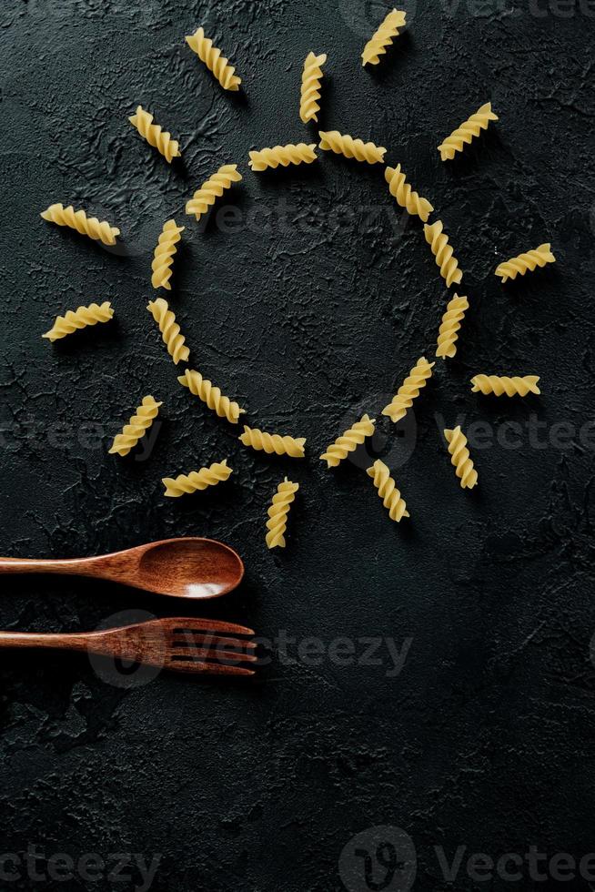 Raw uncooked  Italian pasta in shape of spiral photo
