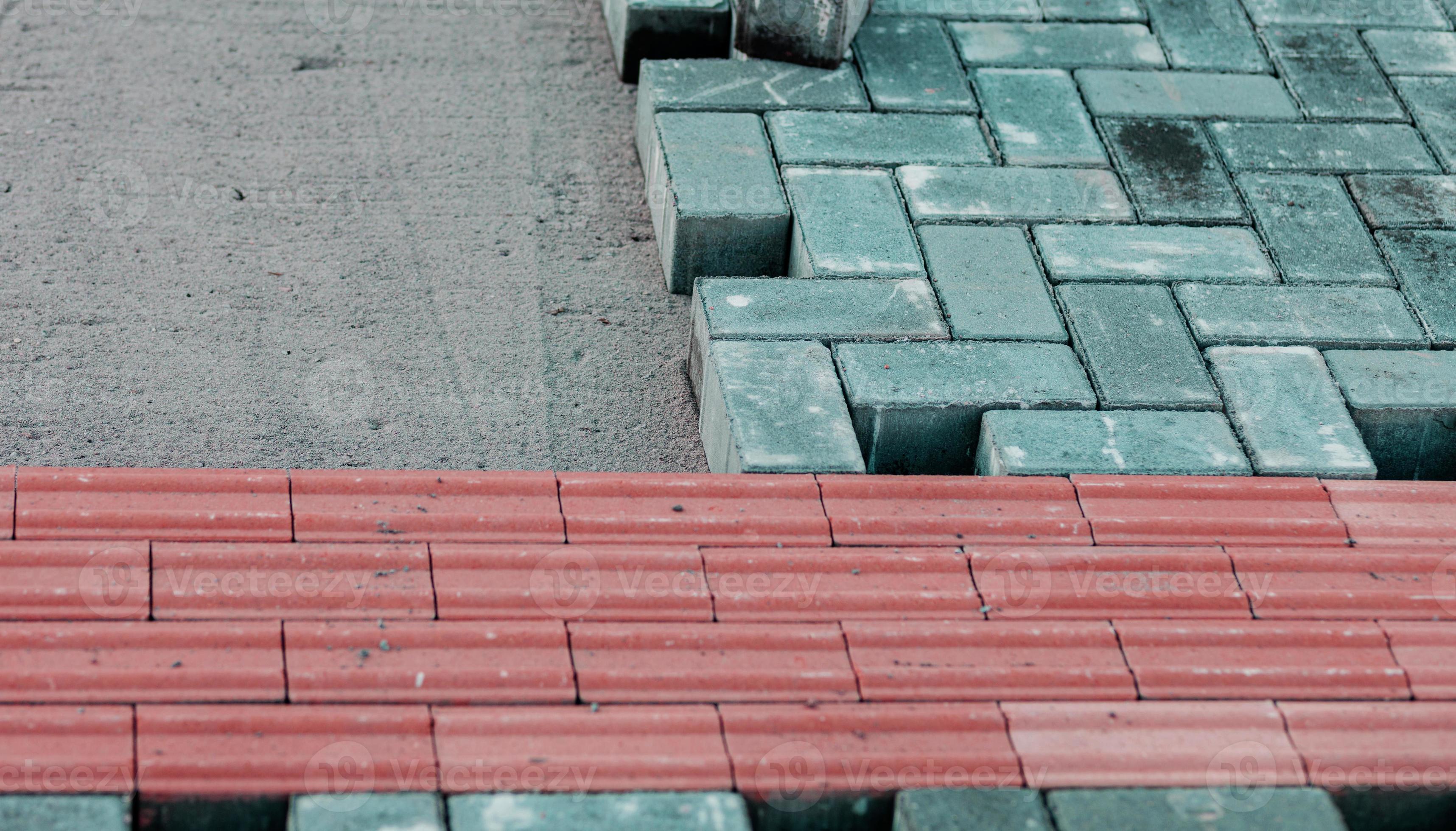 Laying paving slabs 18845340 Stock Photo at Vecteezy