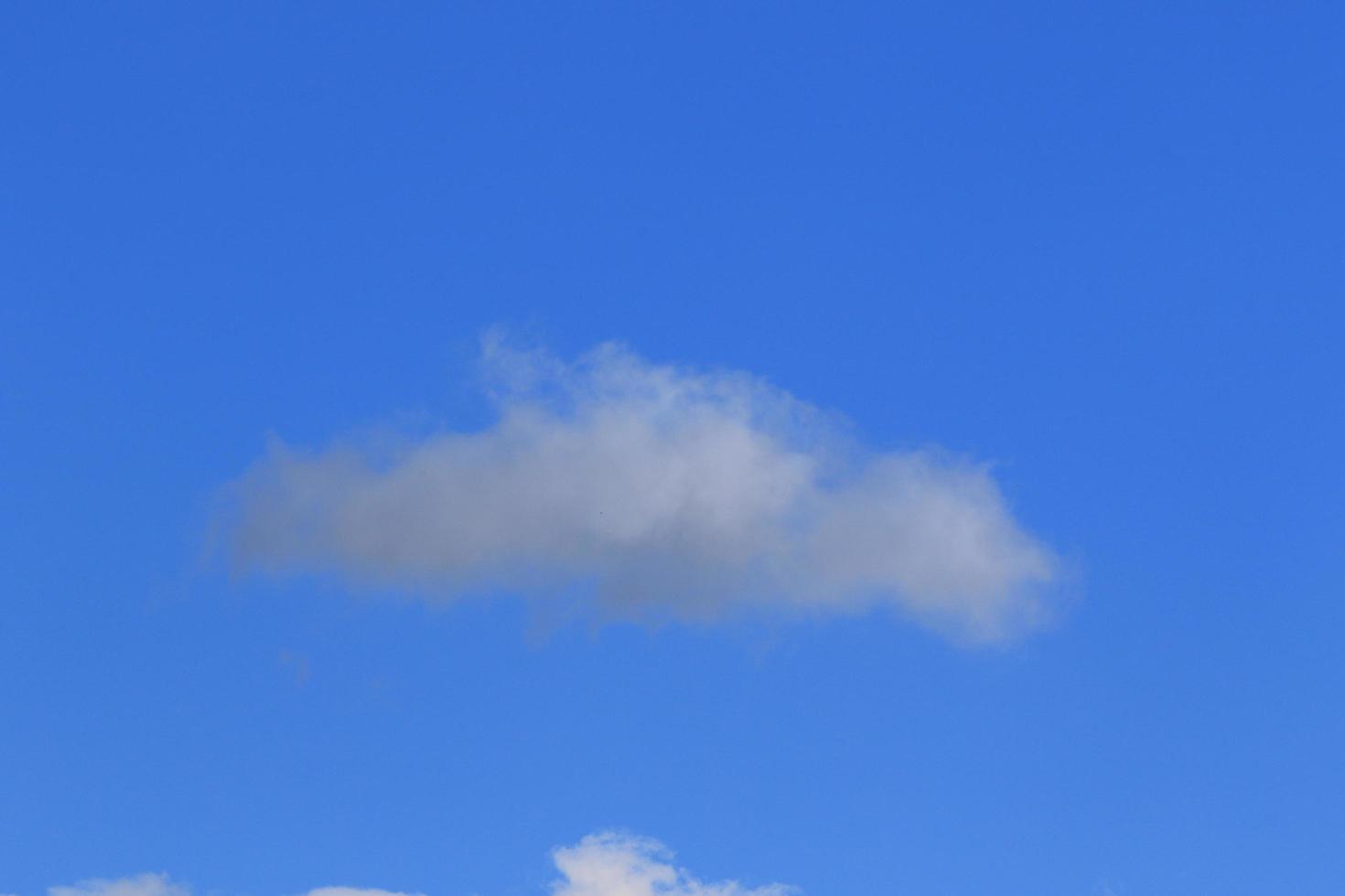 Clear blue sky and white clouds photo