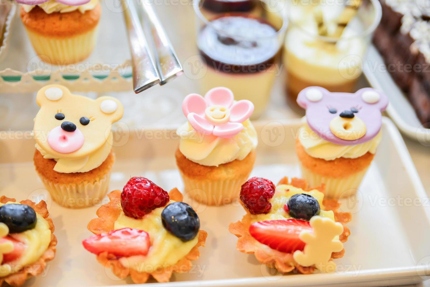 delicious sweets arranged on the table for event reception photo