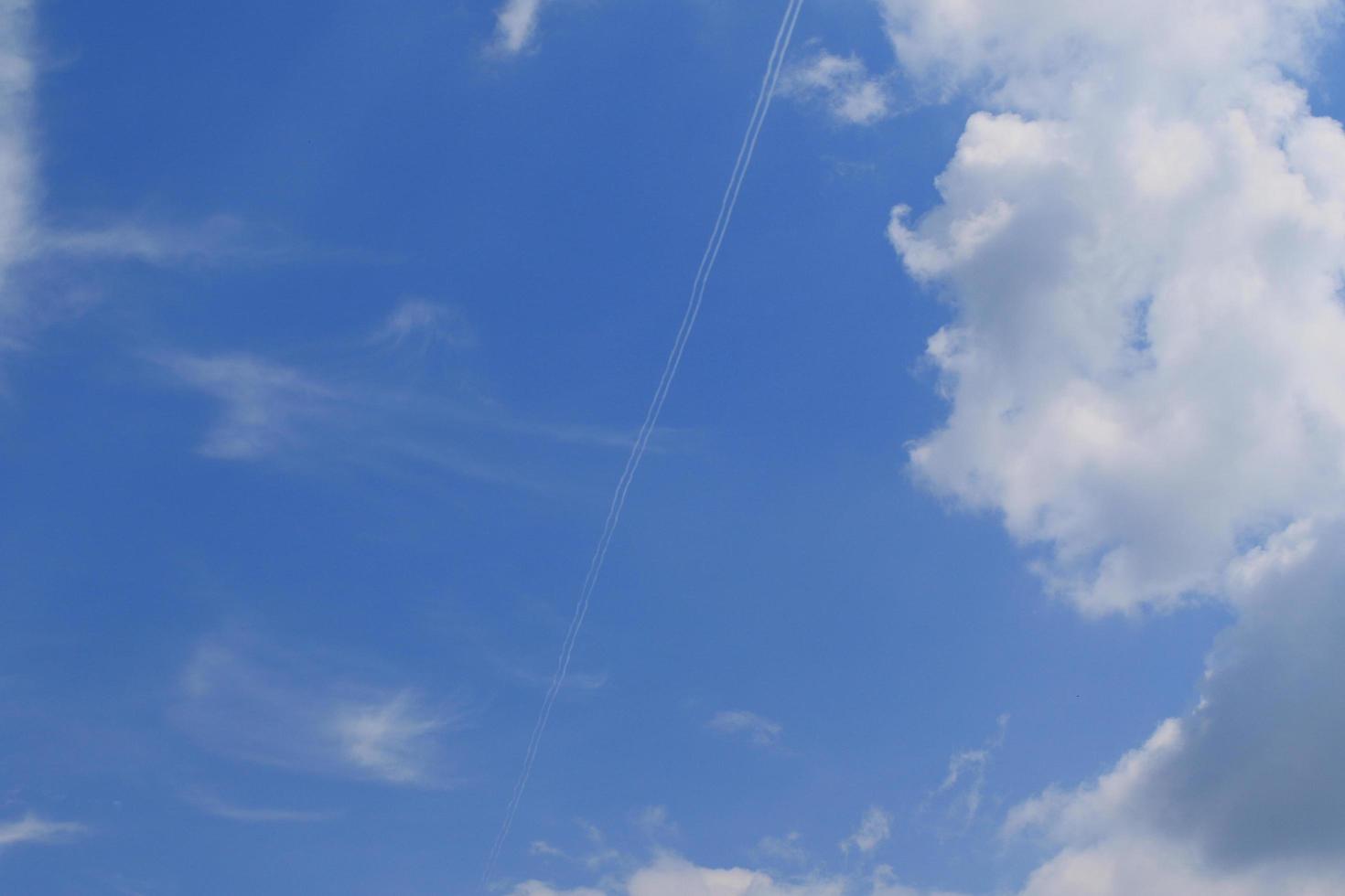 Clear blue sky and white clouds photo