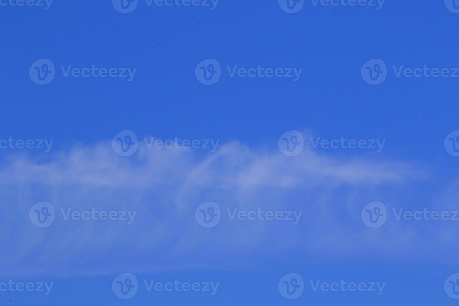 Clear blue sky and white clouds photo