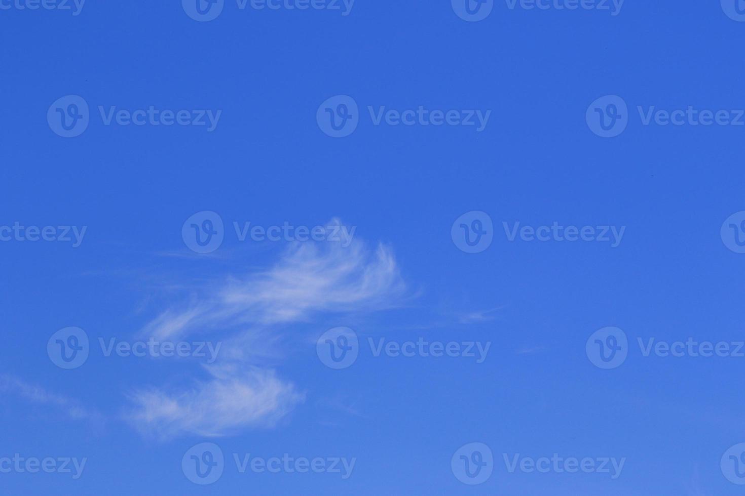 Clear blue sky and white clouds photo