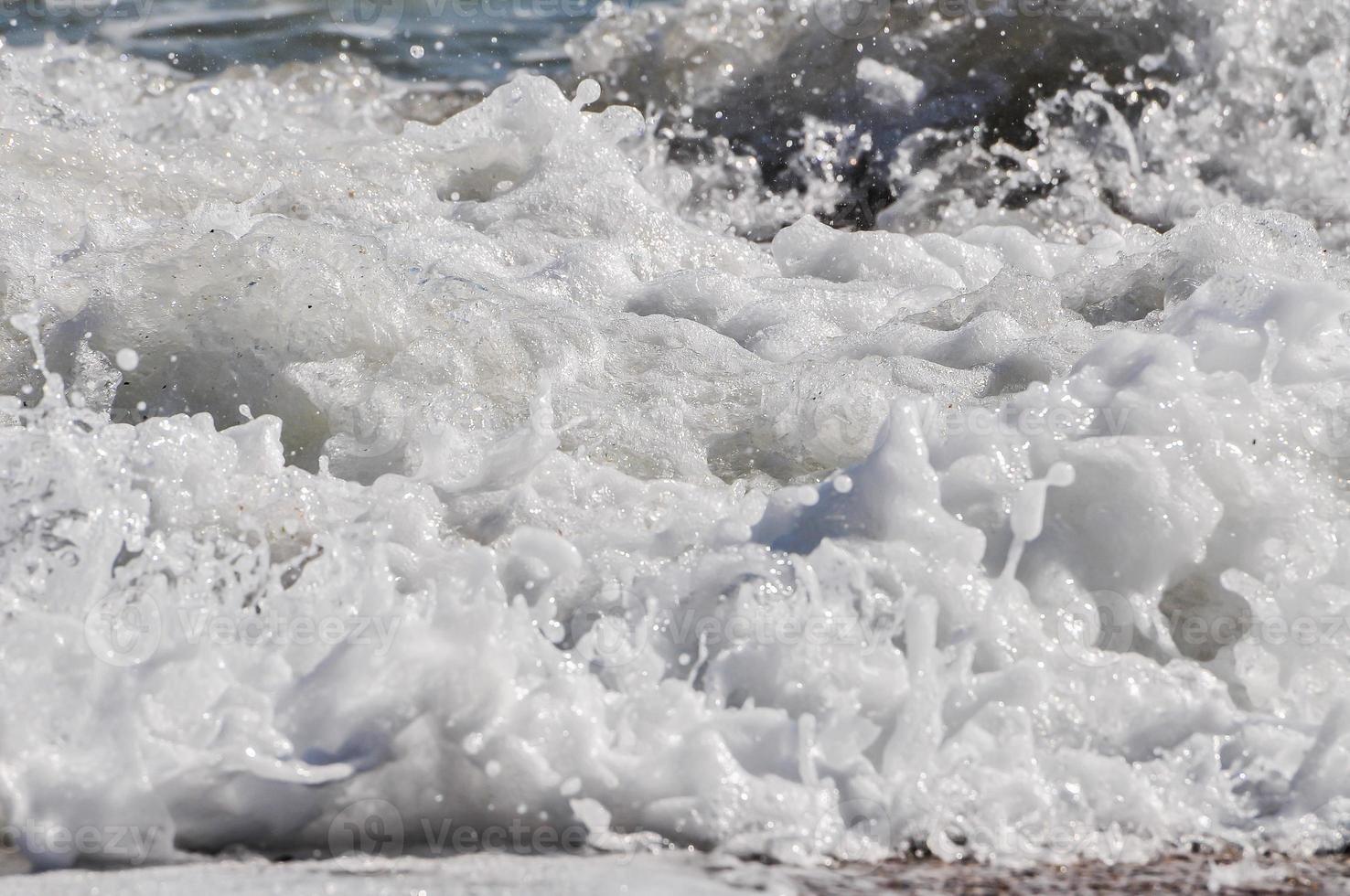 sea foam. splash water photo