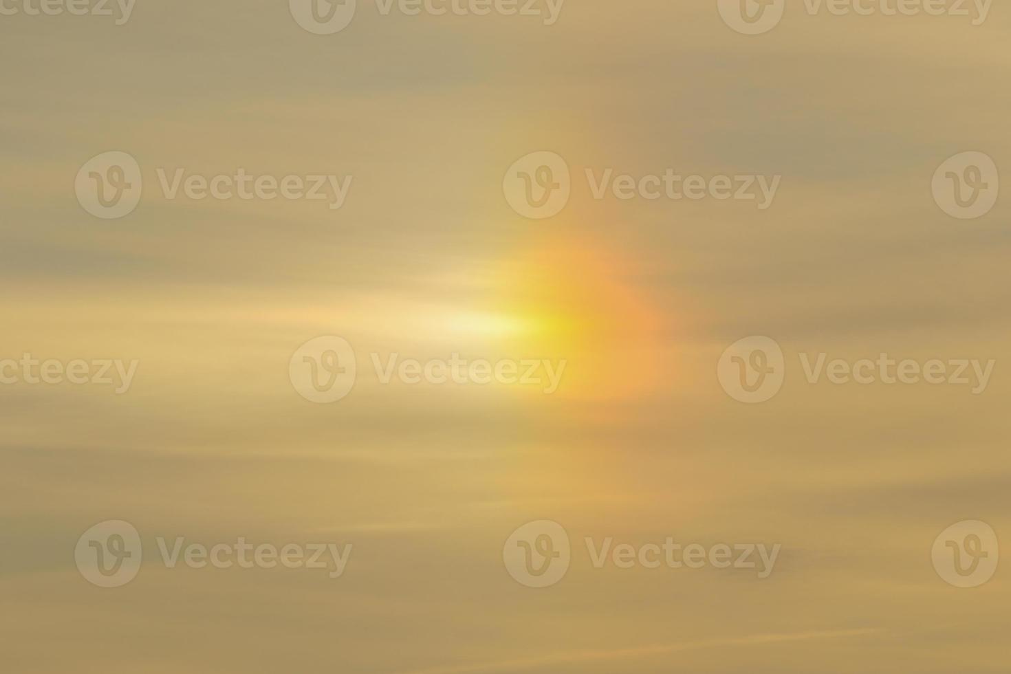 Rays of light shining through dark clouds photo