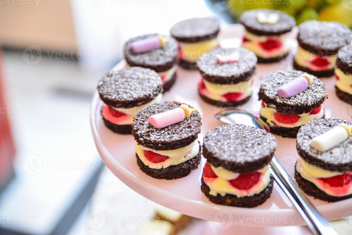 delicious sweets arranged on the table for event reception photo