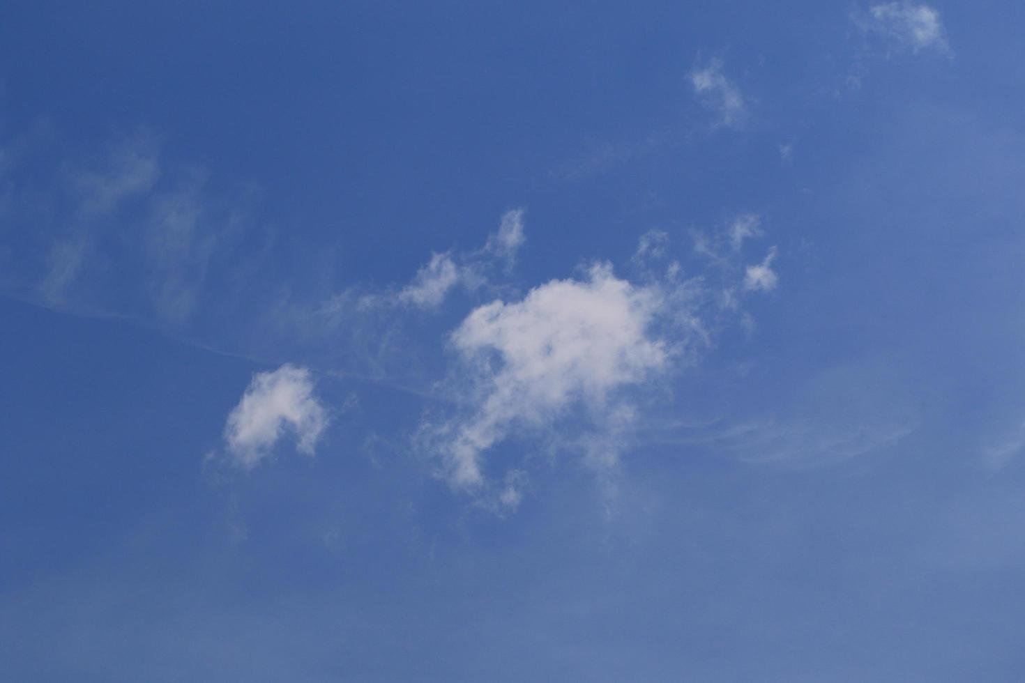 Clear blue sky and white clouds photo