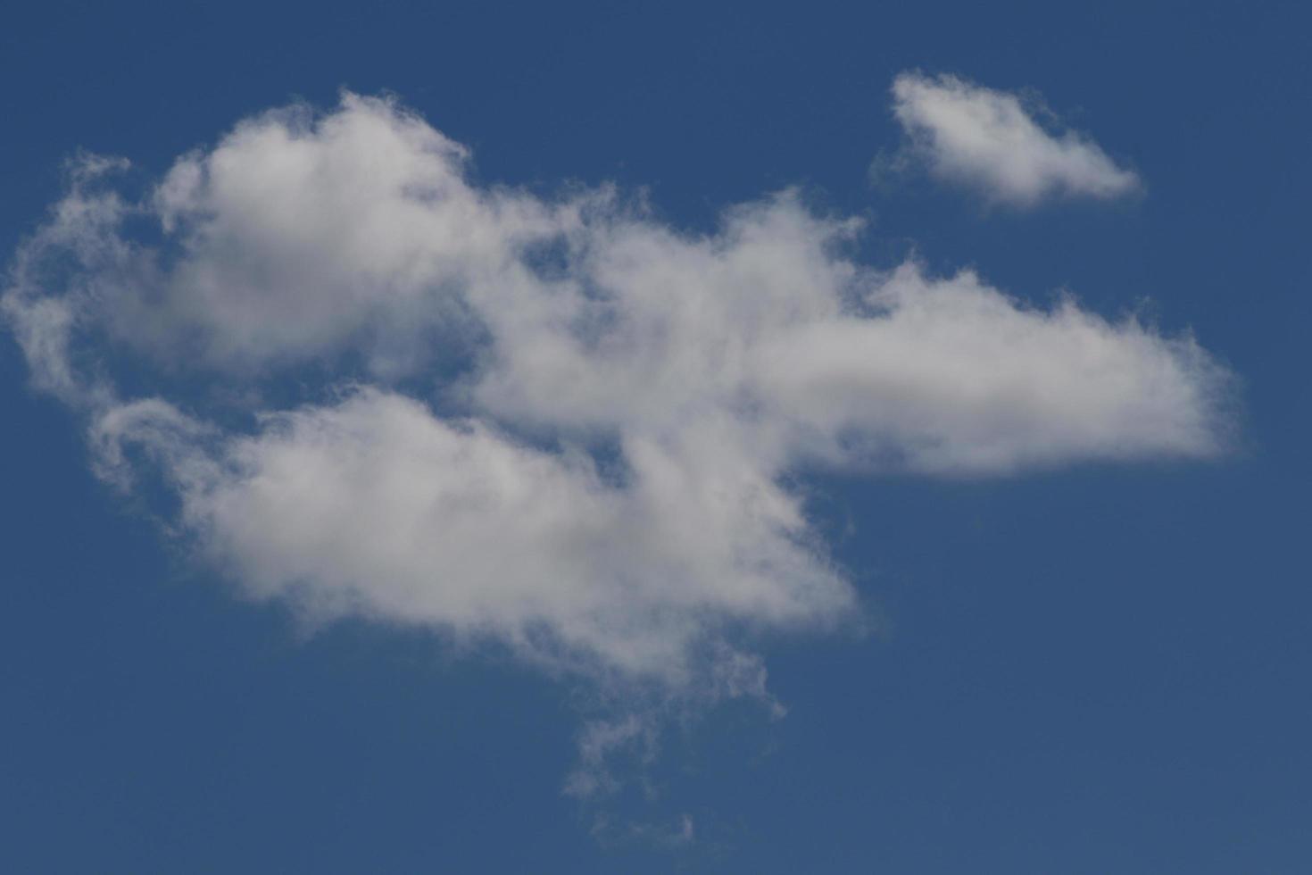 Clear blue sky and white clouds photo