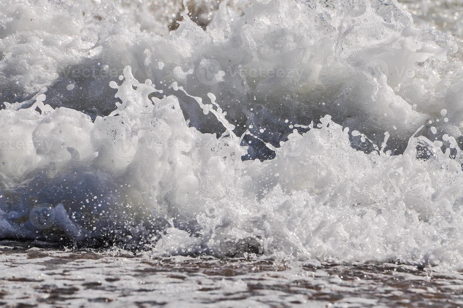 sea foam. splash water photo