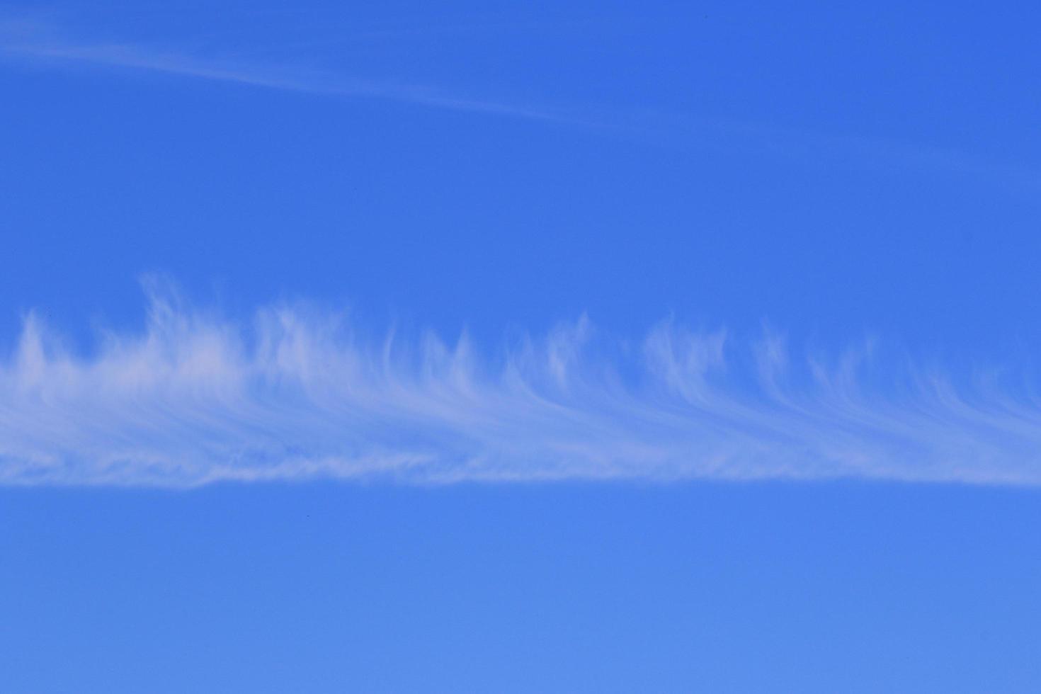 Clear blue sky and white clouds photo