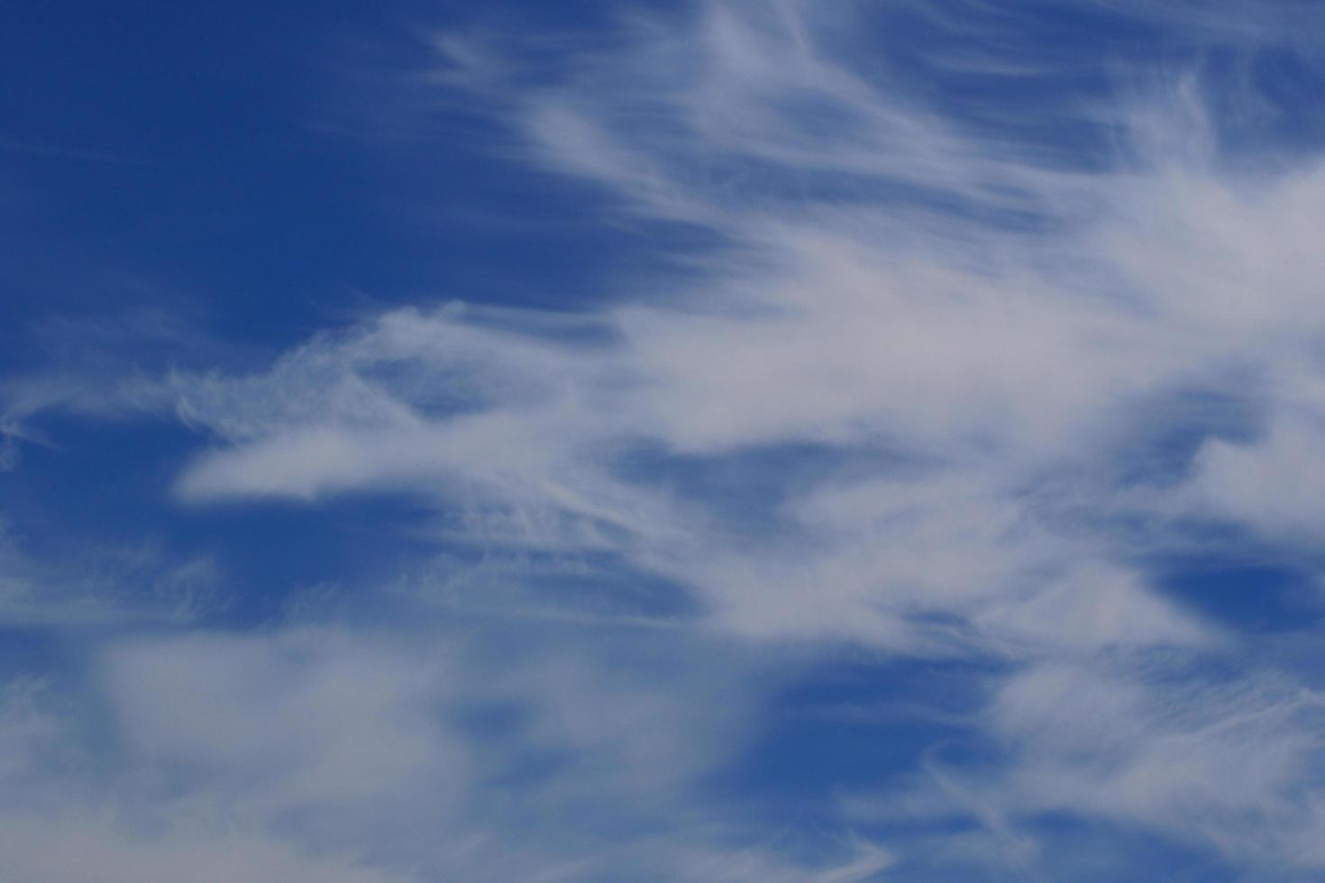 Clear blue sky and white clouds photo