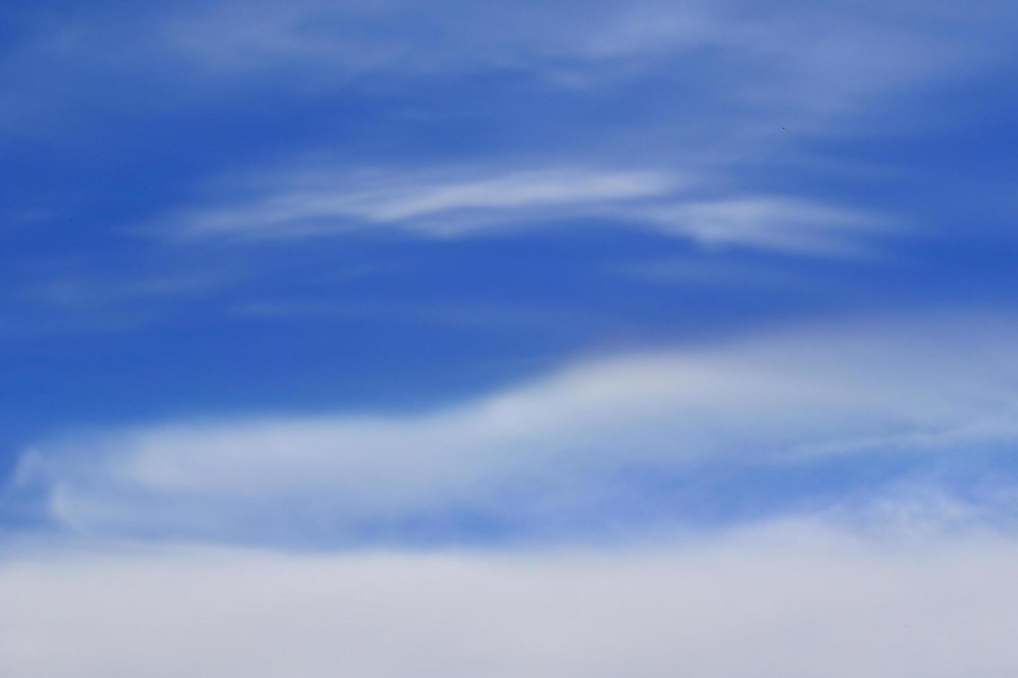 Clear blue sky and white clouds photo